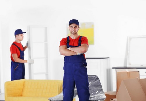 Removal team planning a house move in Soho with boxes and furniture