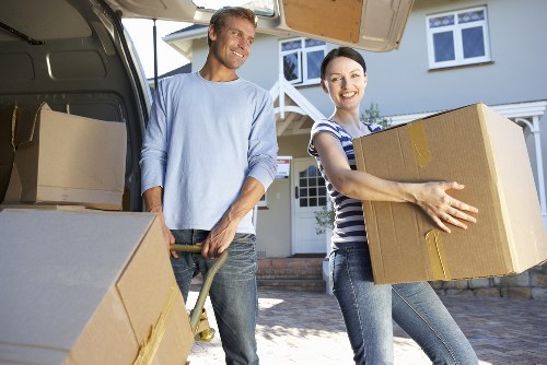 Packed boxes and furniture ready for a Soho moving truck